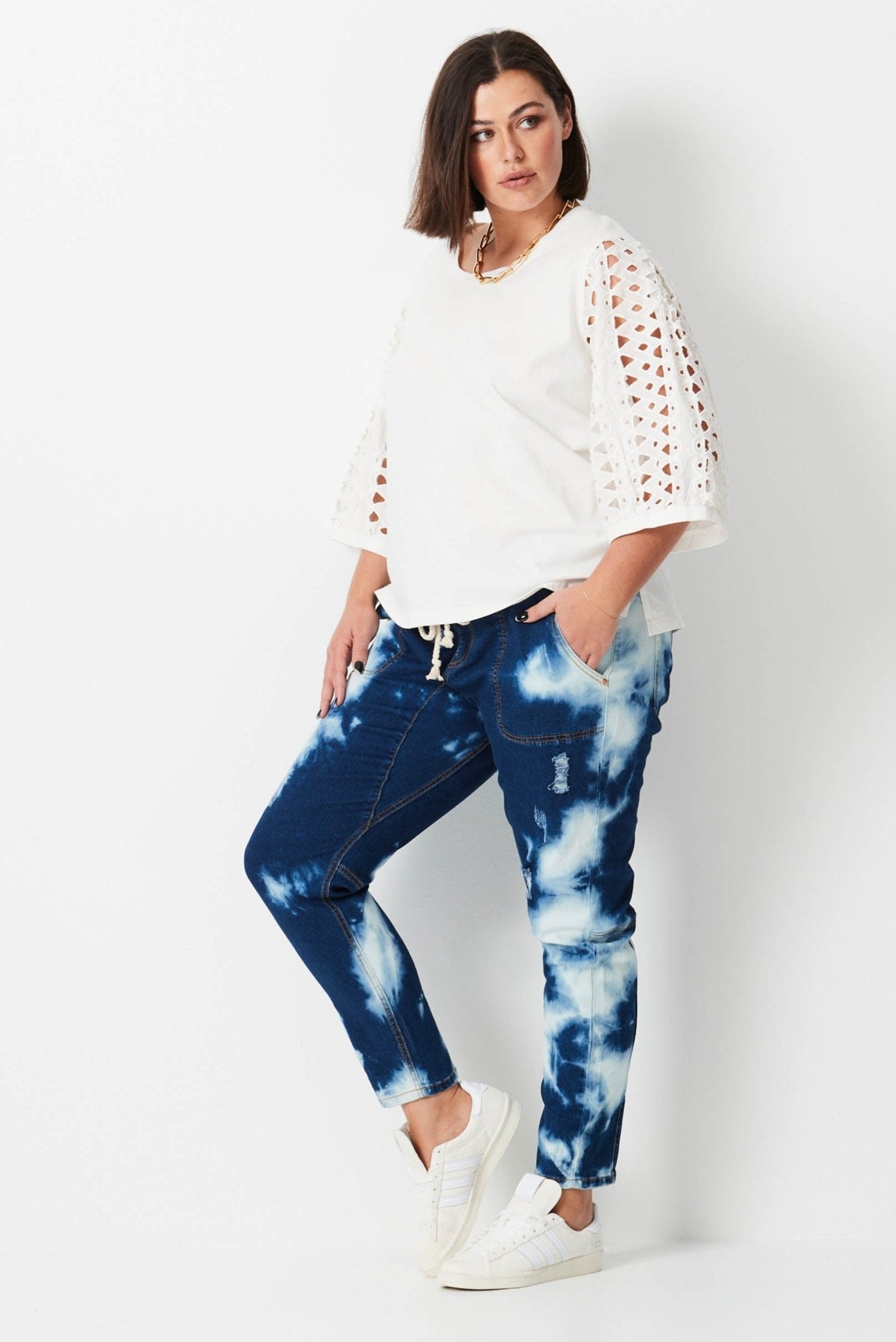 Shibori Keepers - Indigo Wash - 17 Sundays17 SundaysModel wears plus size dark blue tie dye denim jeans. with elastic waist and tapered leg.